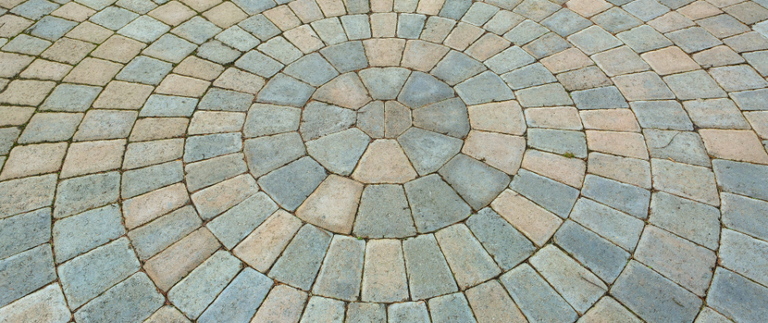 Decorative paver patio with circular pattern
