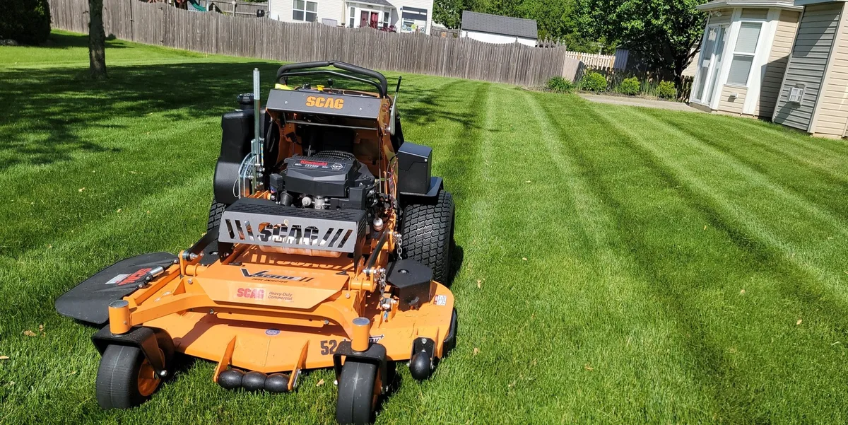 Scag commercial stand-on mower with striped lawn