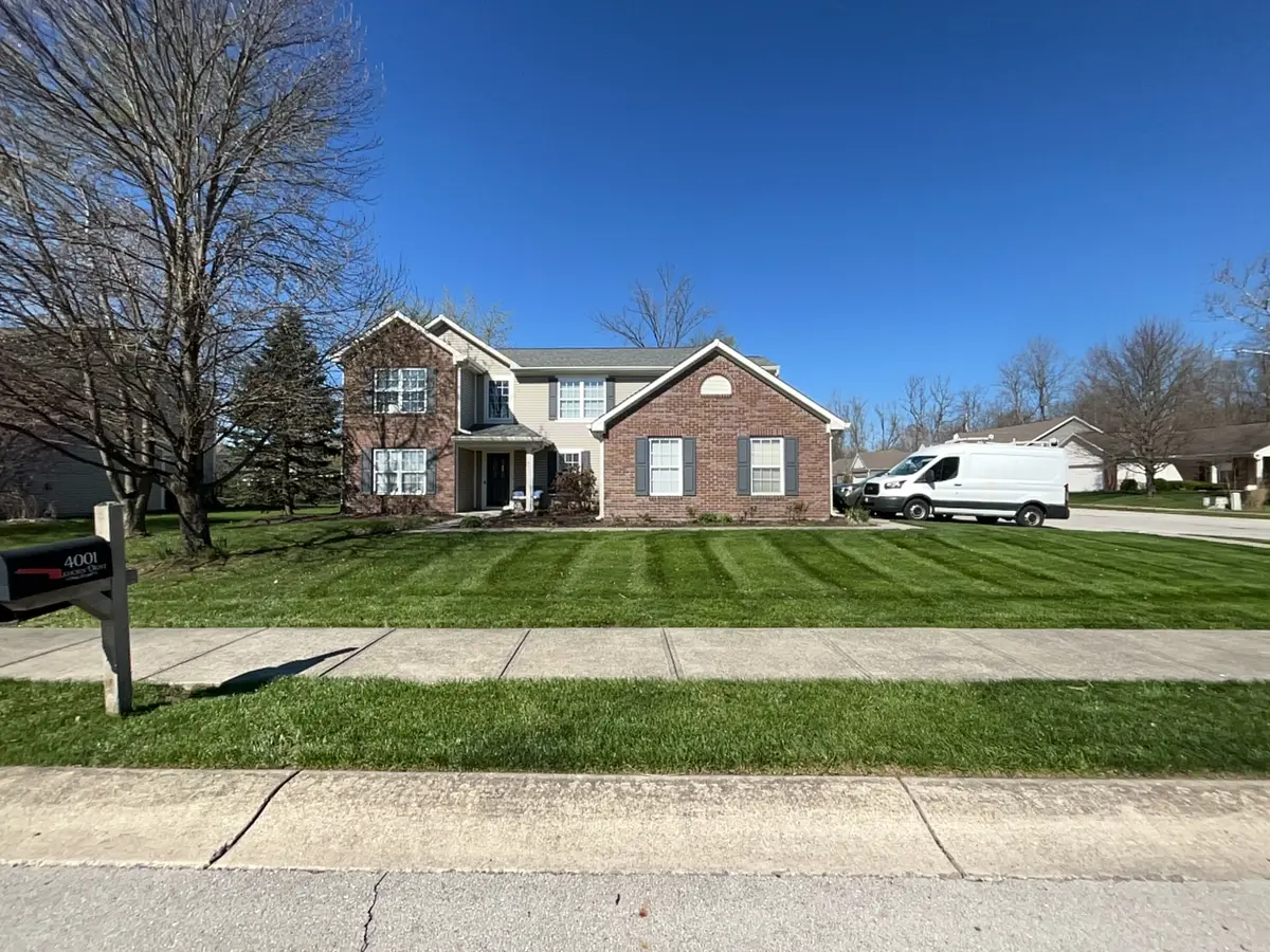 Brick home in Hamilton County with professional lawn mowing stripes